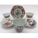 A Chinese famille rose tea bowl and saucer, with two others, 18th Century,