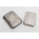 Two silver cigarette covers