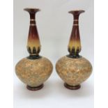 A pair of late 19th century Royal Doulton bottle vases s/d (2)