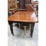 A late Victorian mahogany dining table, one extra leaf, 74cm high, 144cm long,