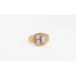 An 18ct, textured yellow gold and diamond ring, circa 1970s, set three round old-cut stones,