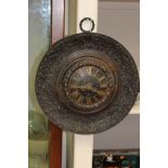 An adapted cast iron clock with wall hanging ring