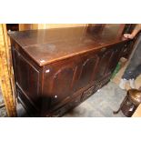 A George III oak mule chest, with a four panelled front,