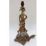 A French ormolu table lamp with a porcelain circular section,
