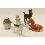 A collection of Beswick figures comprising fawn lying down, brown standing fawn,