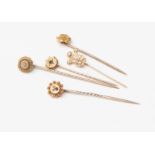 Two 15ct Victorian diamond set stick pins, three yellow metal stone set stick pins,