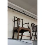 A George III joined oak open armchair, in the Chippendale manner, circa 1765, pierced back splat,