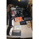 A briefcase and a box of cameras and cassette tapes (2)