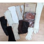 A collection of vintage gloves to include cream leather chamois leather, long evening gloves,