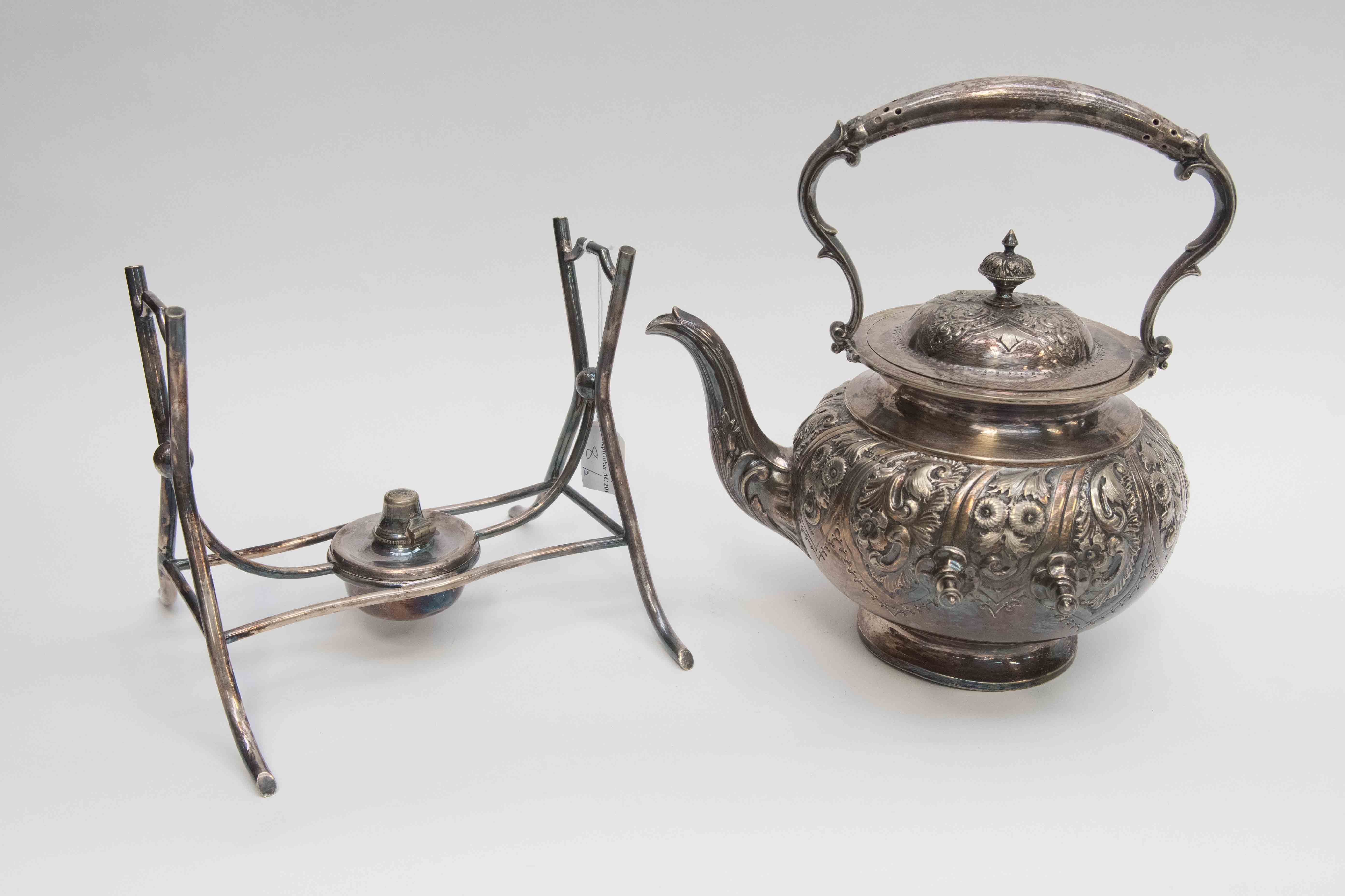 A Victorian embossed silver plated kettle on spirit burner stand,