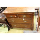 A 19th Century oak and mahogany cross-banded chest of drawers with two short over two long drawers.