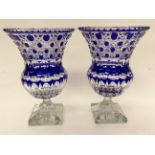 A pair of blue flash glass pedestal vases, measuring approx 27.