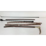 A collection of riding crops to include bamboo, dressage,