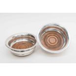 A pair of Eliabeth II silver bottle coasters,