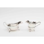 A George VI silver Viners sauce boat, Sheffield 1940; together with a George V silver cream jug,