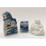 A blue and white seal, modelled with a dog of fo,