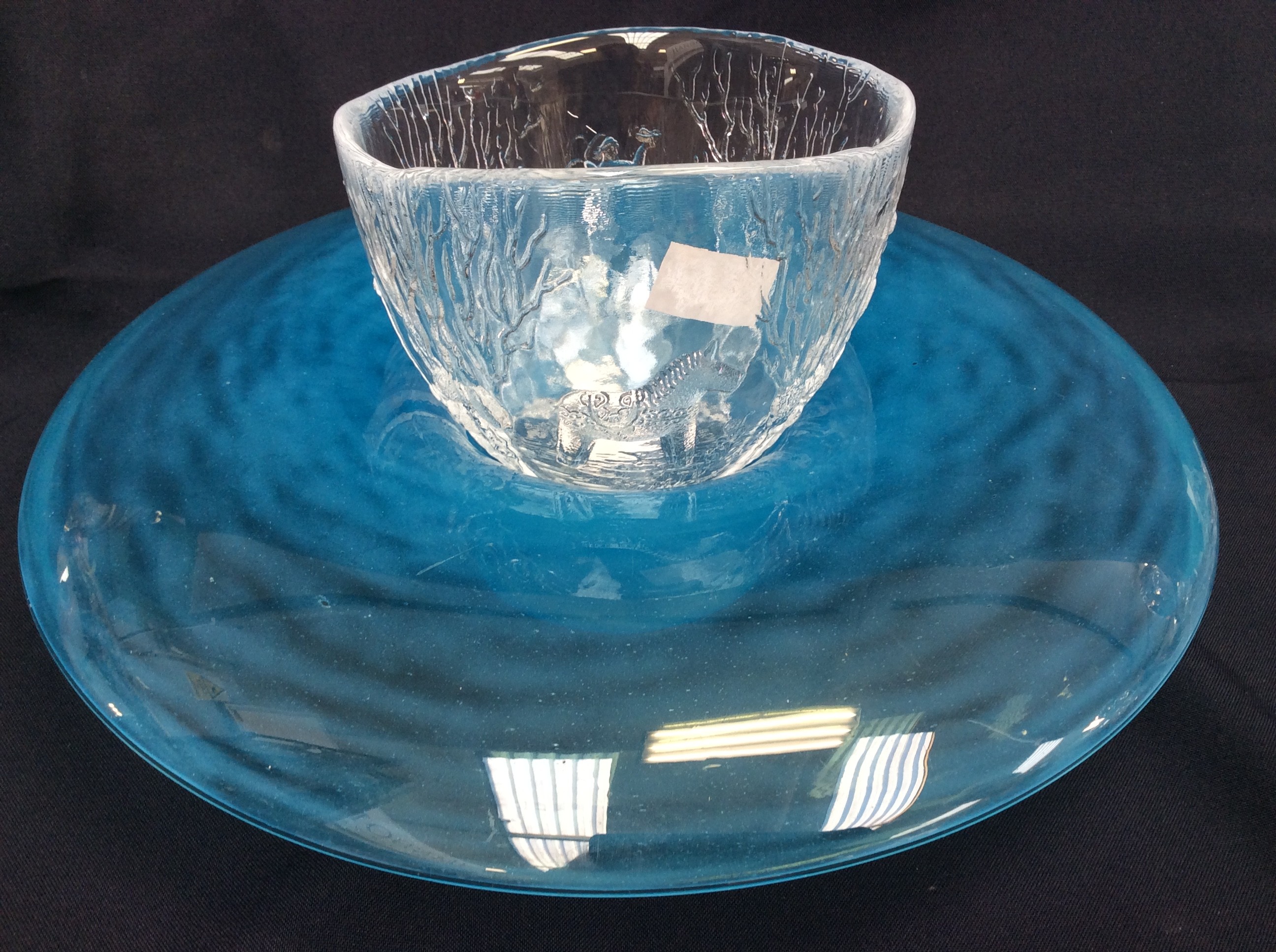 A blue glass bowl, having feature rim,