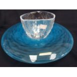 A blue glass bowl, having feature rim,