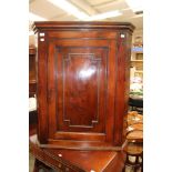 A 19th Century mahogany hanging corner cupboard fitted with a single door.