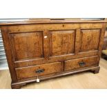 A George III oak mule chest, three panelled front, two drawers below,