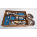 A collection of plated items, to include; flatware, wine coasters, etc.