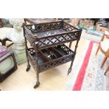 An early 20th Century Gothic pierced two tier tea trolley,