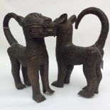 A pair of bronze Benin cats, 20th century, length 30cm x height 38cm.