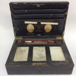 Victorian 'Jemann's and Son' writing slope (af) containing inkwells, pens,