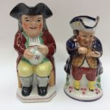Two 19th Century Toby jugs, Allertons hand painted Toby seated on a floral mount,