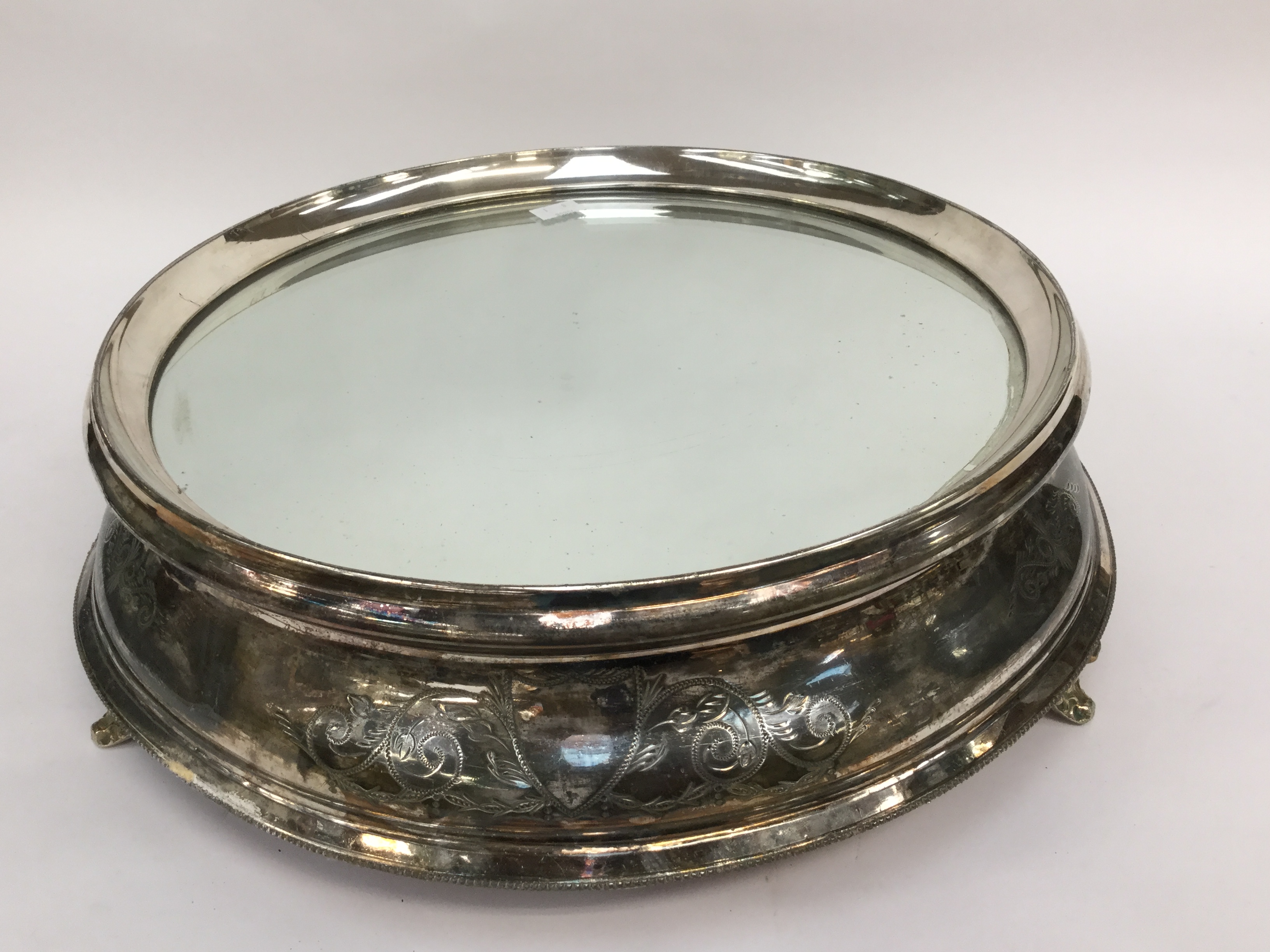 An early twentieth Century mirrored plate stand, silver plated,