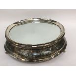 An early twentieth Century mirrored plate stand, silver plated,