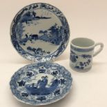A Chinese blue and white moulded saucer, along with another saucer and blue and white,