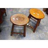 A pair of early 20th Century oak stools,
