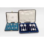 A boxed set of six George V silver teaspoons, Sheffield 1913, with a pair of sugar tongs,