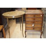 An Edwardian music cabinet and an Edwardian mahogany occasional table.