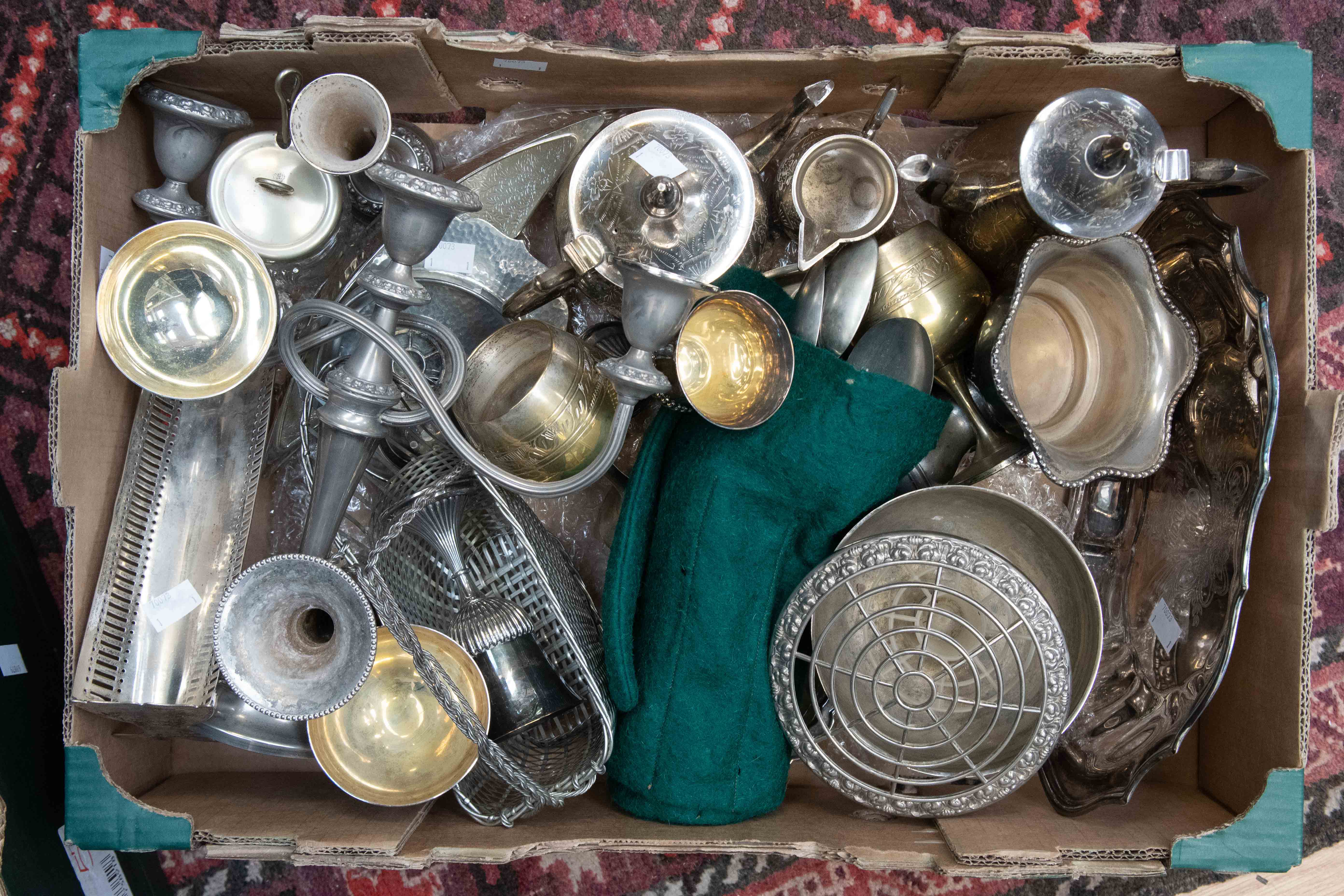 A quantity of silver plated wares to include two canteens, flatware, teaset,
