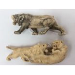 Two carved antique ivory figures of tigers fighting (a/f)