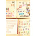 A collection of assorted stamps in four albums and loose,