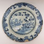 A Chinese tin glazed charger (damage to rim).