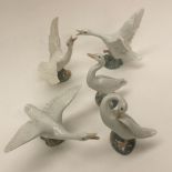 Lladro figures, a set of three geese with outstretched wings,