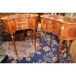 A pair of kidney shaped reproduction side stand/tables,