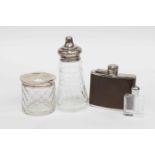 A silver lidded glass jar with diamond cut star detail, a silver topped sugar sifter London,