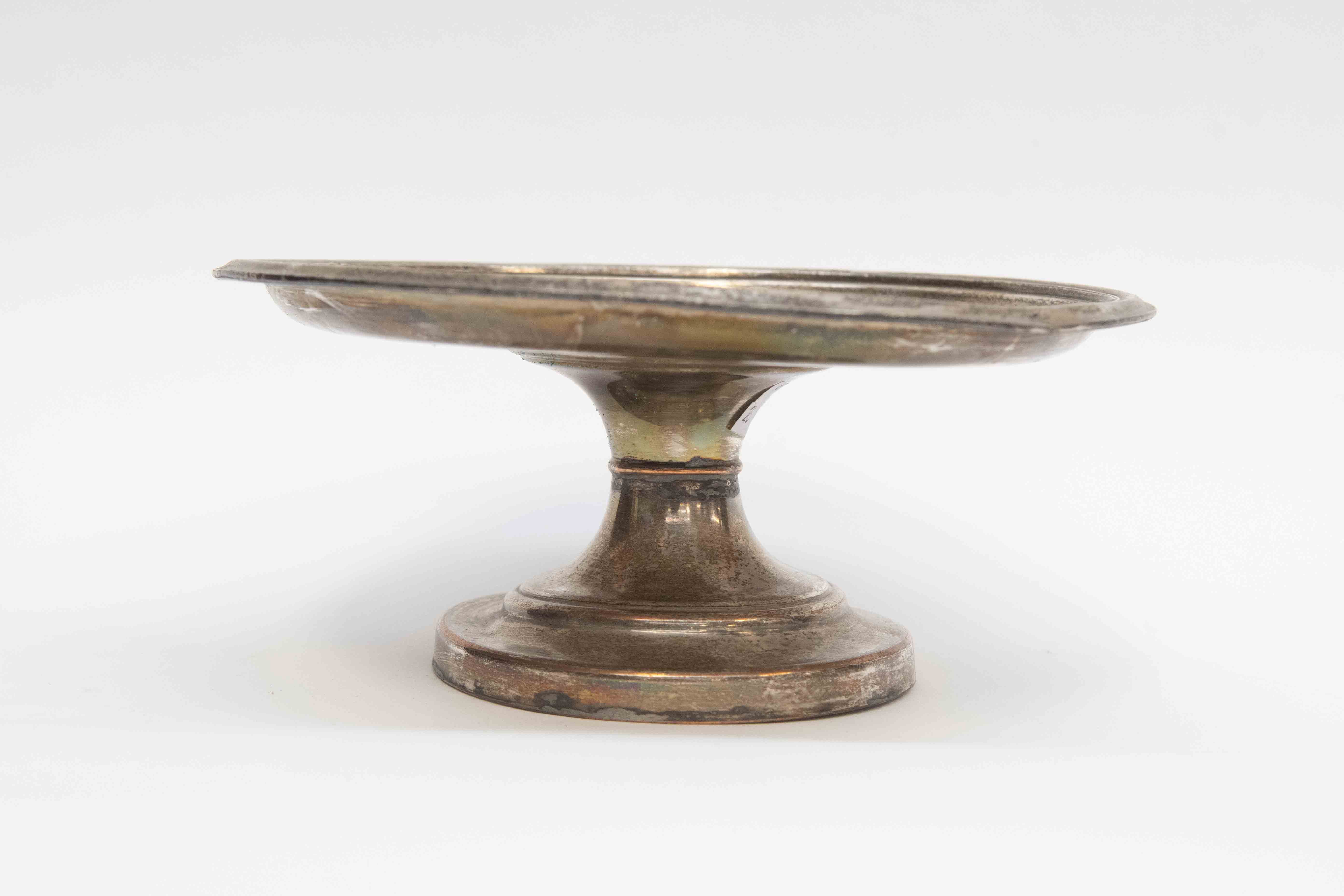 An early 19th Century plate table stand with Casterton chapel on base