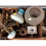 A box of assorted oil lamps, some with glass shades, brass candlesticks, jugs etc.