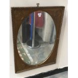 An oval gilt framed, wall,