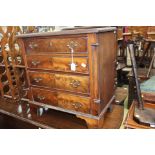 A George III style mahogany four drawer chest, graduated drawers, bracket feet, 67cm high,