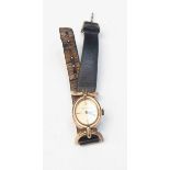 A ladies 9ct Ray King watch on leather strap