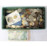 A box of world coins and banknotes