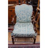 An early 20th Century mahogany open armchair, having a mahogany frame,