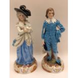 A pair of late 19th Century continental tinted bisque figures,